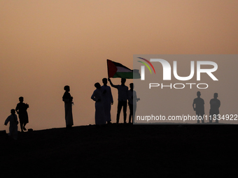 People are gathering to perform Eid prayers on one of the hills in the village of Abu Sir, in the middle of some of the ancient archaeologic...