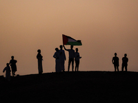 People are gathering to perform Eid prayers on one of the hills in the village of Abu Sir, in the middle of some of the ancient archaeologic...