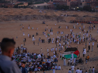 People are gathering to perform Eid prayers on one of the hills in the village of Abu Sir, in the middle of some of the ancient archaeologic...