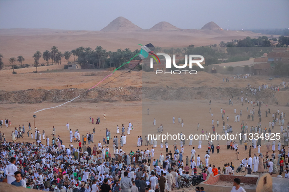 People are gathering to perform Eid prayers on one of the hills in the village of Abu Sir, in the middle of some of the ancient archaeologic...