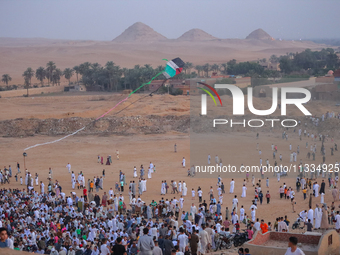 People are gathering to perform Eid prayers on one of the hills in the village of Abu Sir, in the middle of some of the ancient archaeologic...