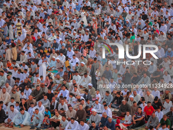 People are gathering to perform Eid prayers on one of the hills in the village of Abu Sir, in the middle of some of the ancient archaeologic...