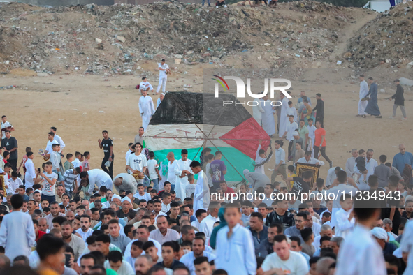 People are gathering to perform Eid prayers on one of the hills in the village of Abu Sir, in the middle of some of the ancient archaeologic...