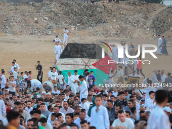 People are gathering to perform Eid prayers on one of the hills in the village of Abu Sir, in the middle of some of the ancient archaeologic...