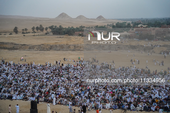 People are gathering to perform Eid prayers on one of the hills in the village of Abu Sir, in the middle of some of the ancient archaeologic...