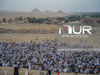 People are gathering to perform Eid prayers on one of the hills in the village of Abu Sir, in the middle of some of the ancient archaeologic...