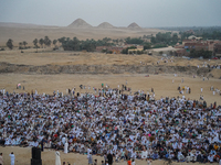 People are gathering to perform Eid prayers on one of the hills in the village of Abu Sir, in the middle of some of the ancient archaeologic...