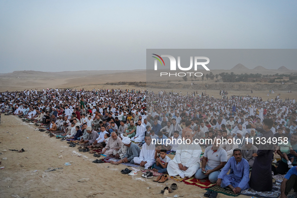 People are gathering to perform Eid prayers on one of the hills in the village of Abu Sir, in the middle of some of the ancient archaeologic...