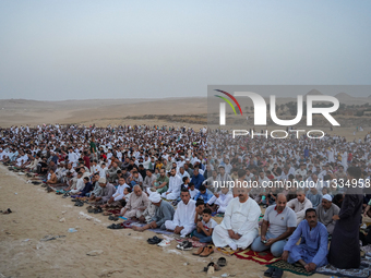 People are gathering to perform Eid prayers on one of the hills in the village of Abu Sir, in the middle of some of the ancient archaeologic...