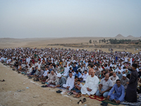 People are gathering to perform Eid prayers on one of the hills in the village of Abu Sir, in the middle of some of the ancient archaeologic...