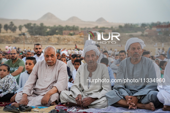 People are gathering to perform Eid prayers on one of the hills in the village of Abu Sir, in the middle of some of the ancient archaeologic...