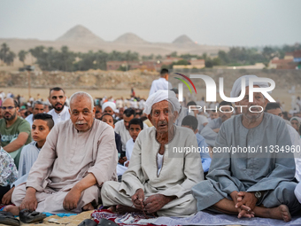 People are gathering to perform Eid prayers on one of the hills in the village of Abu Sir, in the middle of some of the ancient archaeologic...