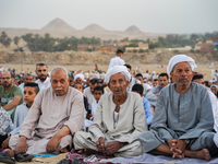 People are gathering to perform Eid prayers on one of the hills in the village of Abu Sir, in the middle of some of the ancient archaeologic...