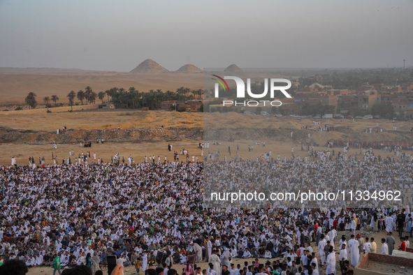 People are gathering to perform Eid prayers on one of the hills in the village of Abu Sir, in the middle of some of the ancient archaeologic...