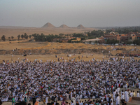 People are gathering to perform Eid prayers on one of the hills in the village of Abu Sir, in the middle of some of the ancient archaeologic...