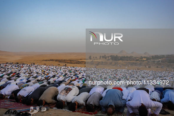 People are gathering to perform Eid prayers on one of the hills in the village of Abu Sir, in the middle of some of the ancient archaeologic...