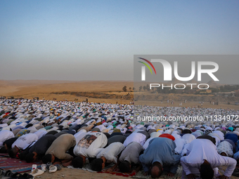 People are gathering to perform Eid prayers on one of the hills in the village of Abu Sir, in the middle of some of the ancient archaeologic...