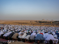 People are gathering to perform Eid prayers on one of the hills in the village of Abu Sir, in the middle of some of the ancient archaeologic...