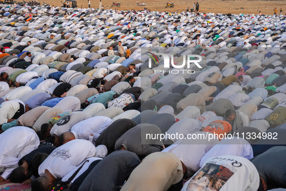 People are gathering to perform Eid prayers on one of the hills in the village of Abu Sir, in the middle of some of the ancient archaeologic...