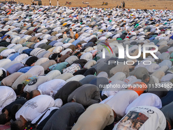 People are gathering to perform Eid prayers on one of the hills in the village of Abu Sir, in the middle of some of the ancient archaeologic...