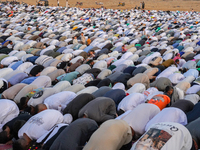 People are gathering to perform Eid prayers on one of the hills in the village of Abu Sir, in the middle of some of the ancient archaeologic...