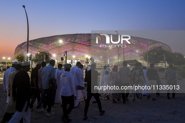 Muslim worshippers are arriving for the Eid al-Adha morning prayers at the Education City Stadium on the first day of the Eid al-Adha holida...