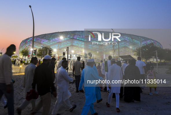 Muslim worshippers are arriving for the Eid al-Adha morning prayers at the Education City Stadium on the first day of the Eid al-Adha holida...