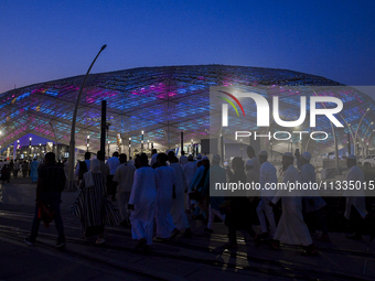 Muslim worshippers are arriving for the Eid al-Adha morning prayers at the Education City Stadium on the first day of the Eid al-Adha holida...