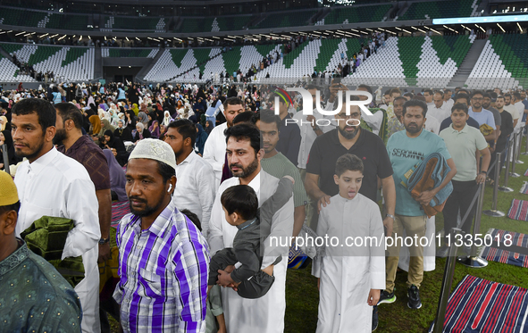 Muslim worshippers are arriving for the Eid al-Adha morning prayers at the Education City Stadium on the first day of the Eid al-Adha holida...