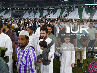 Muslim worshippers are arriving for the Eid al-Adha morning prayers at the Education City Stadium on the first day of the Eid al-Adha holida...