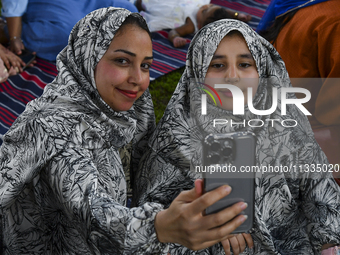 The girls are celebrating after Eid al-Adha morning prayers inside Education City Stadium on the first day of Eid al-Adha holiday in Doha, Q...