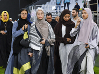 Muslim women are arriving for the Eid al-Adha morning prayers at the Education City Stadium on the first day of the Eid al-Adha holiday in D...