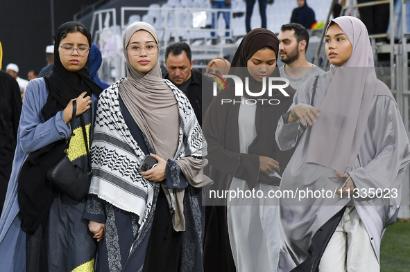 Muslim women are arriving for the Eid al-Adha morning prayers at the Education City Stadium on the first day of the Eid al-Adha holiday in D...