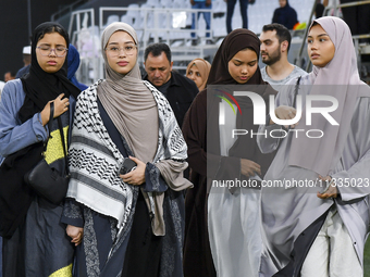 Muslim women are arriving for the Eid al-Adha morning prayers at the Education City Stadium on the first day of the Eid al-Adha holiday in D...