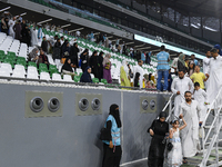 Muslim worshippers are arriving for the Eid al-Adha morning prayers at the Education City Stadium on the first day of the Eid al-Adha holida...