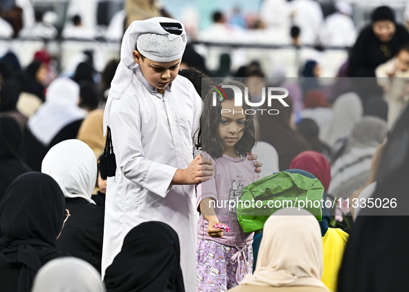 The children are celebrating after Eid al-Adha morning prayers inside Education City Stadium on the first day of the Eid al-Adha holiday in...