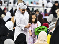 The children are celebrating after Eid al-Adha morning prayers inside Education City Stadium on the first day of the Eid al-Adha holiday in...