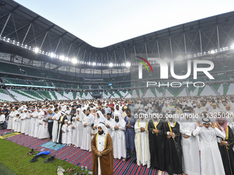 Worshipers are performing Eid al-Adha prayers at the Education City Stadium on the first day of the Eid al-Adha holiday in Doha, Qatar, on J...