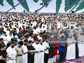 Worshipers are performing Eid al-Adha prayers at the Education City Stadium on the first day of the Eid al-Adha holiday in Doha, Qatar, on J...