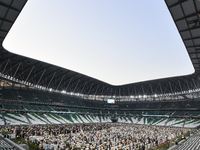 Worshipers are performing Eid al-Adha prayers at the Education City Stadium on the first day of the Eid al-Adha holiday in Doha, Qatar, on J...