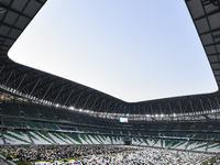 Worshipers are performing Eid al-Adha prayers at the Education City Stadium on the first day of the Eid al-Adha holiday in Doha, Qatar, on J...