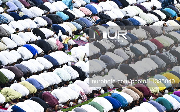 Worshipers are performing Eid al-Adha prayers at the Education City Stadium on the first day of the Eid al-Adha holiday in Doha, Qatar, on J...