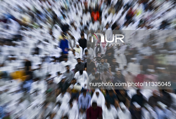 Worshipers are performing Eid al-Adha prayers at the Education City Stadium on the first day of the Eid al-Adha holiday in Doha, Qatar, on J...