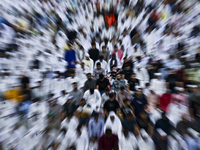 Worshipers are performing Eid al-Adha prayers at the Education City Stadium on the first day of the Eid al-Adha holiday in Doha, Qatar, on J...