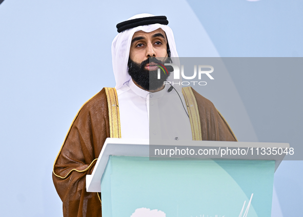 A Qatari imam Ahmed Al-Dosari is giving a sermon in front of worshipers after the Eid al-Adha prayer at the Education City Stadium on the fi...