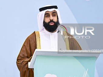 A Qatari imam Ahmed Al-Dosari is giving a sermon in front of worshipers after the Eid al-Adha prayer at the Education City Stadium on the fi...