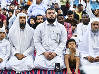 Worshipers are performing Eid al-Adha prayers at the Education City Stadium on the first day of the Eid al-Adha holiday in Doha, Qatar, on J...