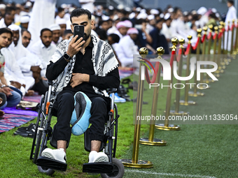 Worshipers are performing Eid al-Adha prayers at the Education City Stadium on the first day of the Eid al-Adha holiday in Doha, Qatar, on J...