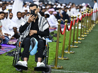 Worshipers are performing Eid al-Adha prayers at the Education City Stadium on the first day of the Eid al-Adha holiday in Doha, Qatar, on J...