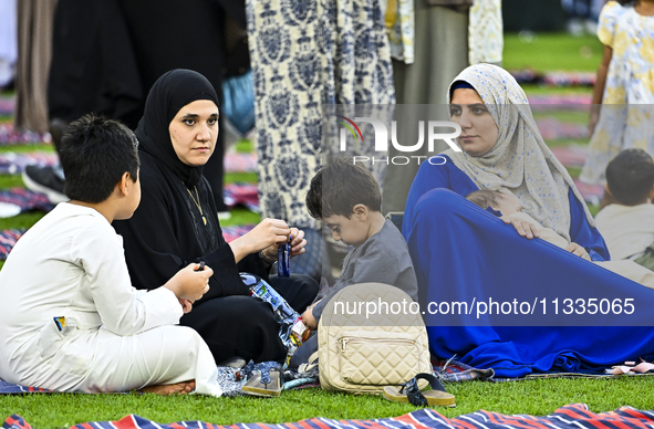 People are gathering after Eid al-Adha morning prayer at the Education City Stadium on the first day of the Eid al-Adha holiday in Doha, Qat...